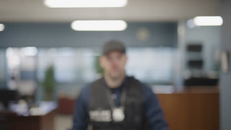 caucasian police detective in modern garb stepping into focus