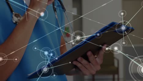 Animation-of-network-of-connections-over-caucasian-female-doctor-using-tablet