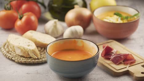 person eating salmorejo with ham and bread, eating time lapse