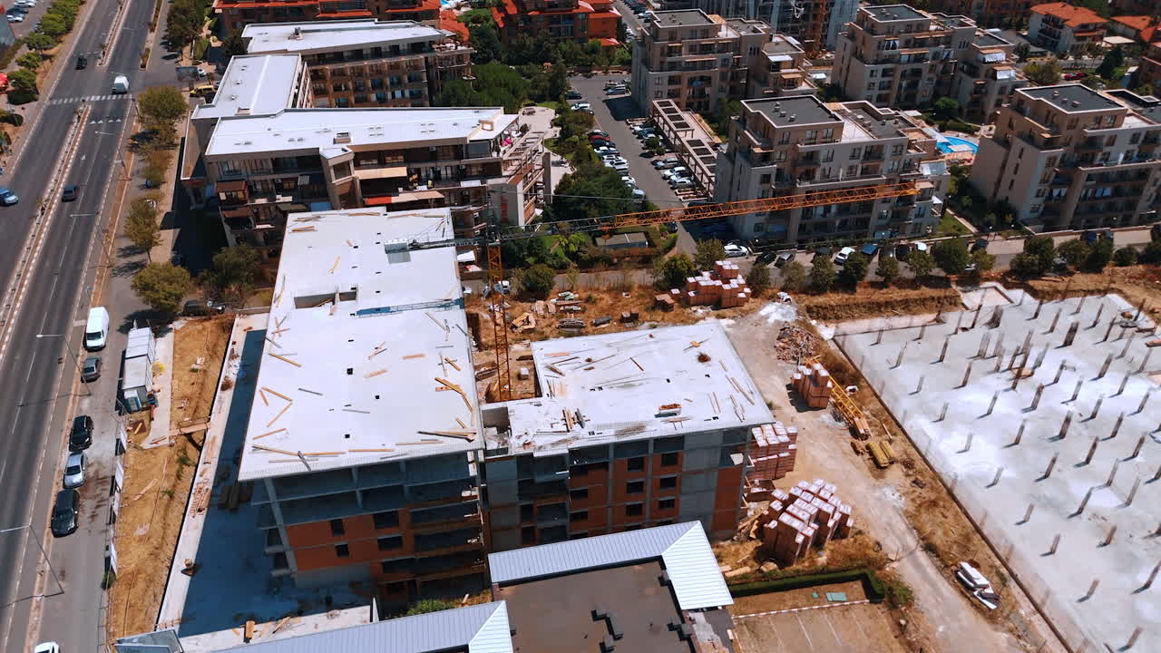 Varna, Bulgaria, 11 July 2025: Urban residential building projects. Construction progresses on residential buildings in a bustling urban area, showcasing ongoing development projects