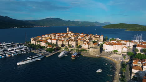 luka korculanska beach, old town and marina of korcula in croatia. - aerial shot