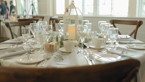 elegant white wedding reception dinning table setup at a restaurant venue at the strathmere wedding venue and resort spa