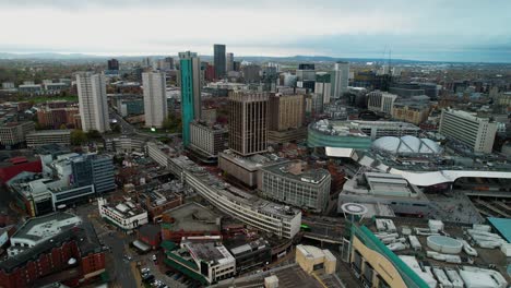 push in aerial over the modern landscape of birmingham city centre and the bull ring