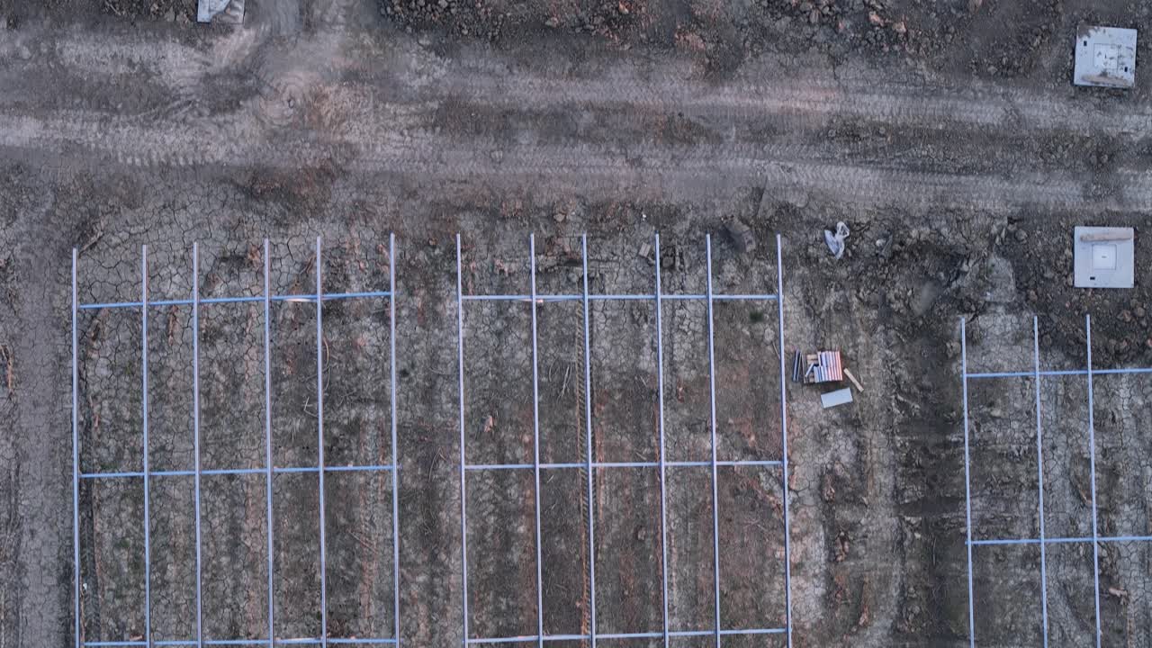 Constructing a large solar farm infrastructure on agricultural fields, supporting clean energy transition through government incentives and sustainable development