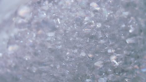 transparent foam bubbles movement and bursting in white bowl