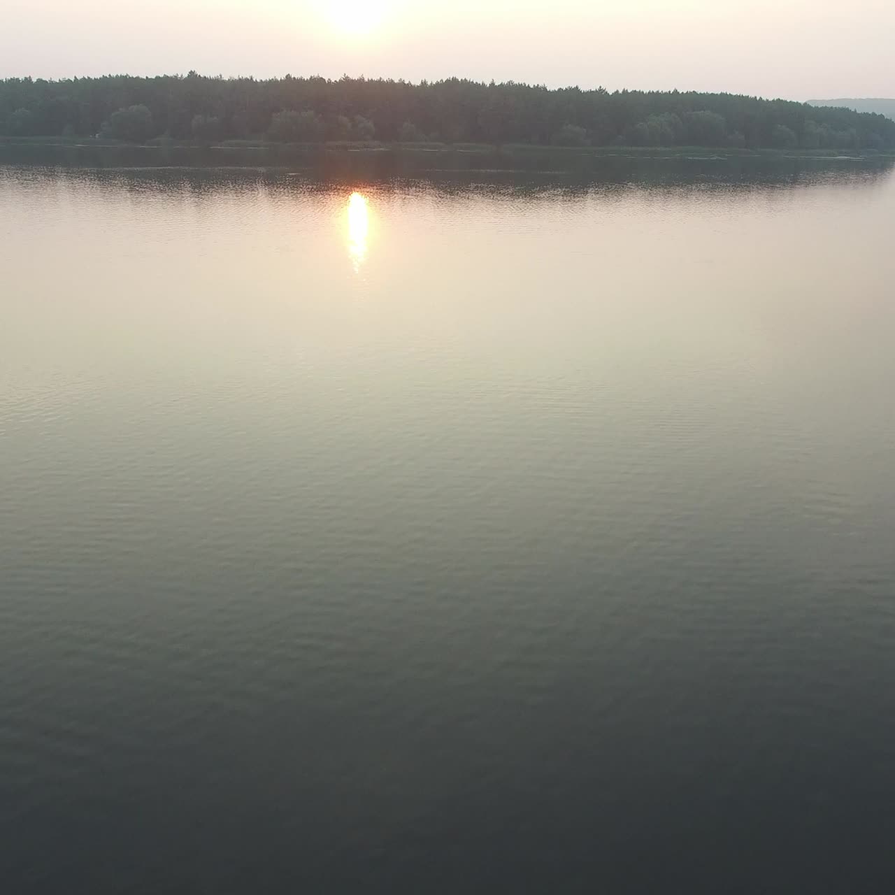 Couple Resting On River Bank