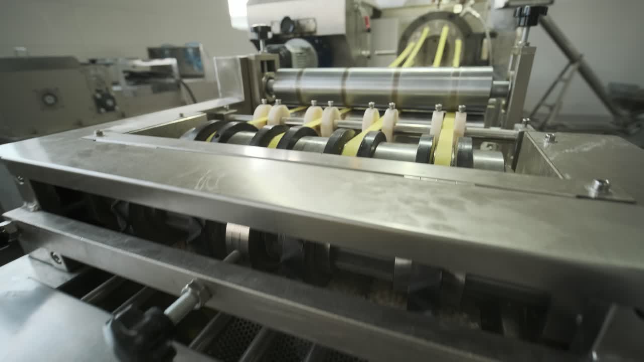 Production factory line moves potato snackes. Production line of the pasta factory, pasta production