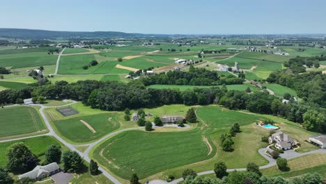 An-aerial-flight-over-the-rural-farmland-of-southern-Lancaster-County,-Pennsylvania-3