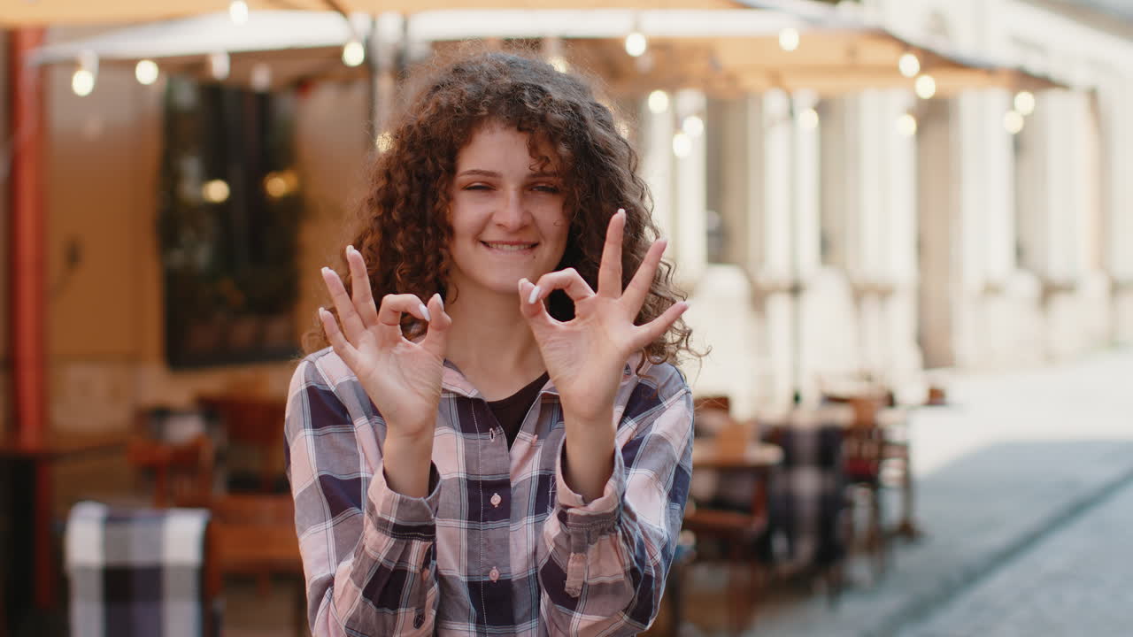 Happy cheerful woman girl showing ok gesture positive like sign approve something good celebrate