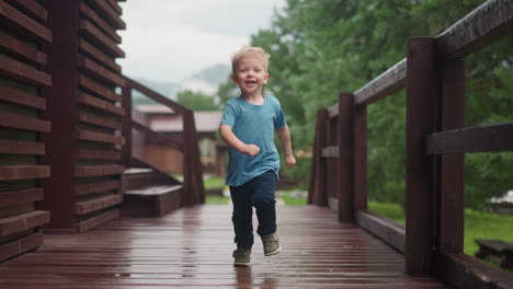 little boy runs to hug loving parent along veranda deck