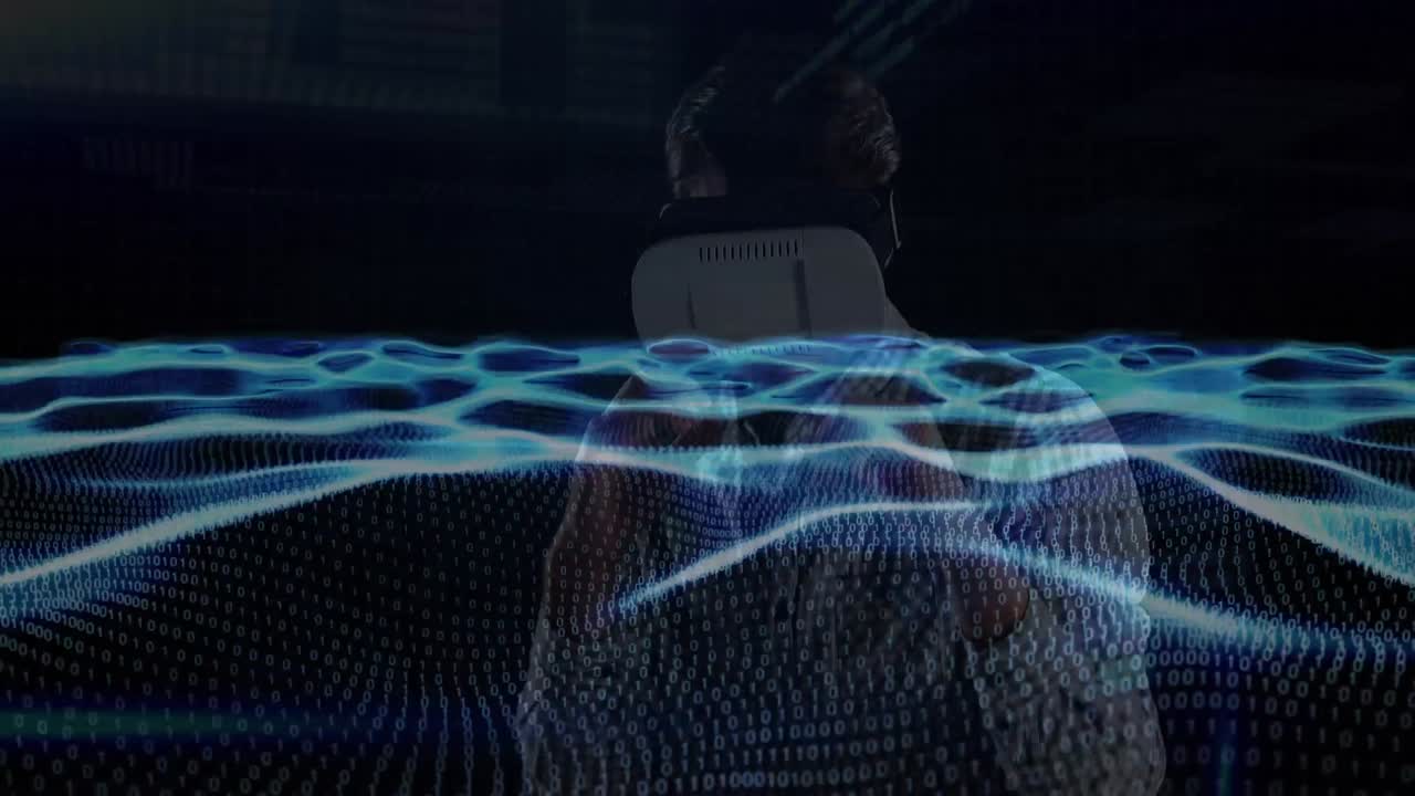 Animation of waves of binary coding over man wearing vr headset