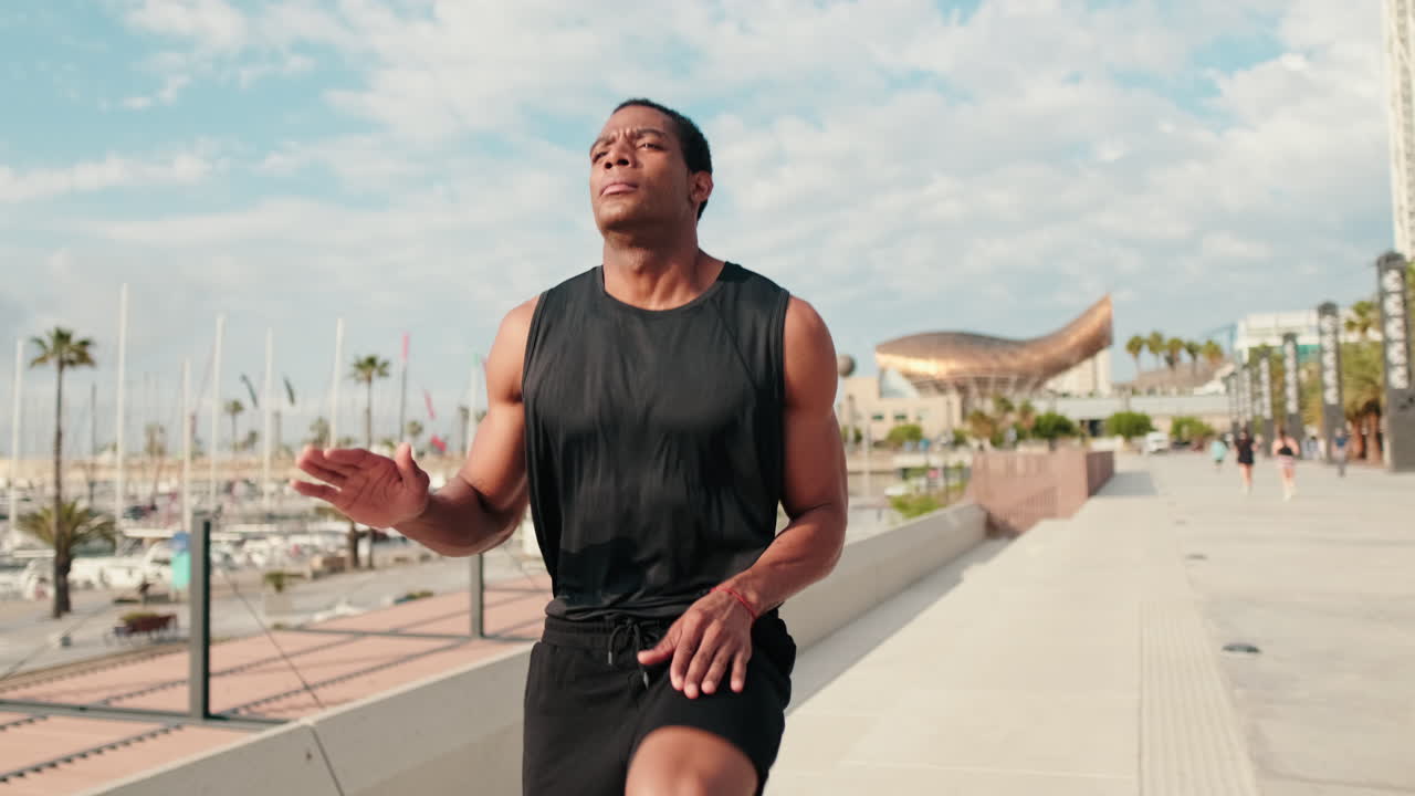 Man Warming Up For a Run by The Marina