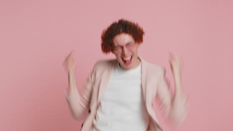 mime caucasian curly haired man pulling an imaginary unreal invisible rope, puts lot of effort into