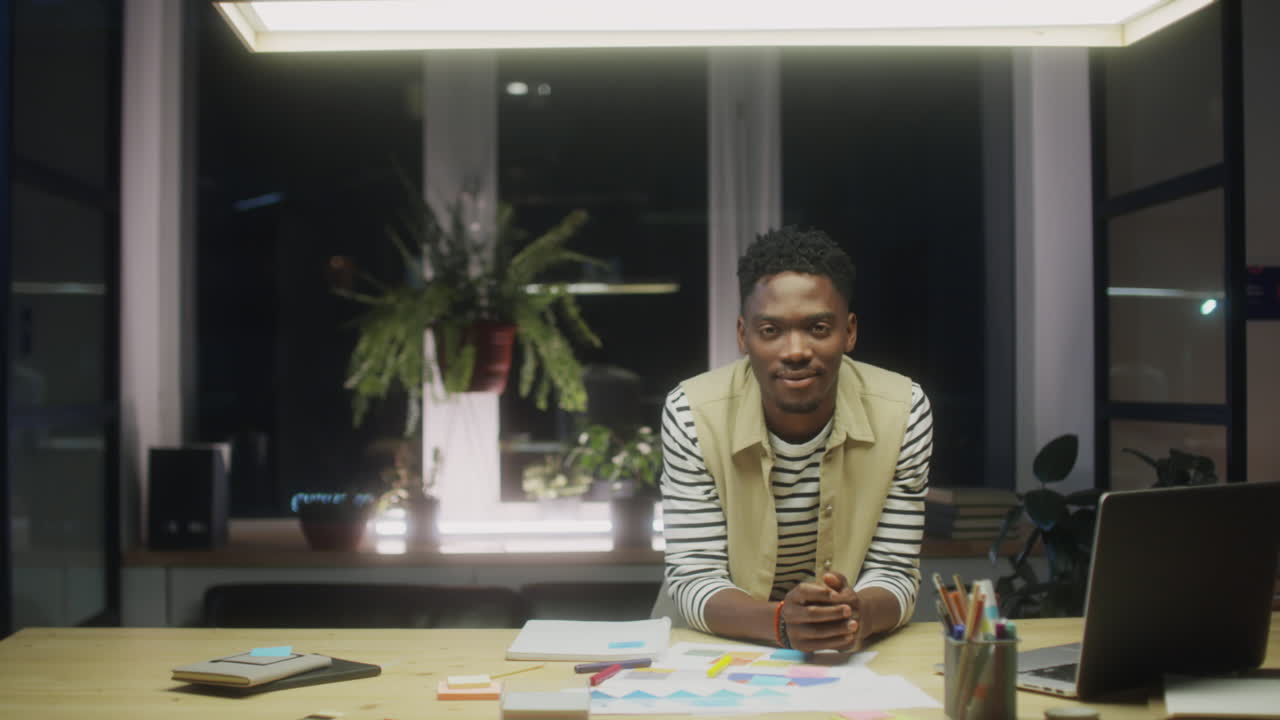 Portrait of Black Businessman in Office at Night