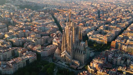 barcelona eixample residential district and famous basilica sagrada familia at sunset. catalonia, spain