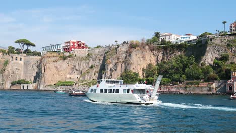 ship sailing near cliffs in sorrento, italy