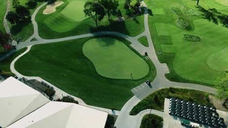 aerial drone rotating shot over a clubhouse beside