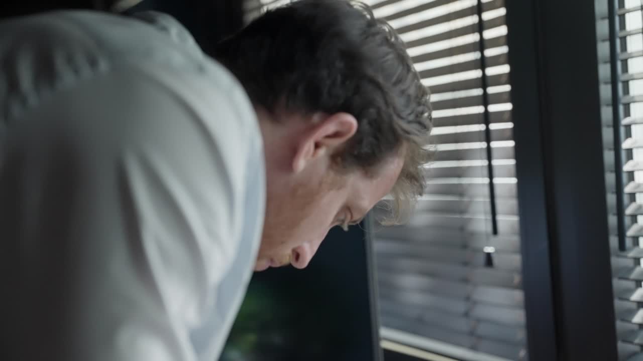 Spy or secret agent reviews classified documents spread across office desk, discreetly snapping photos with smartphone. espionage, covert operations, and intelligence gathering, surveillance. thief