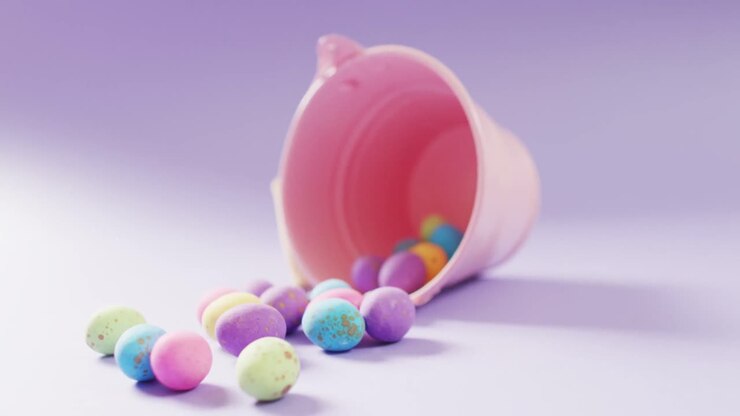 Bucket with colorful easter eggs on purple background with copy space