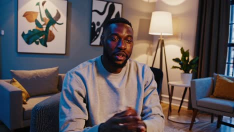 Casual video setup with a medium close-up angle, featuring a person in a cozy living room, modern