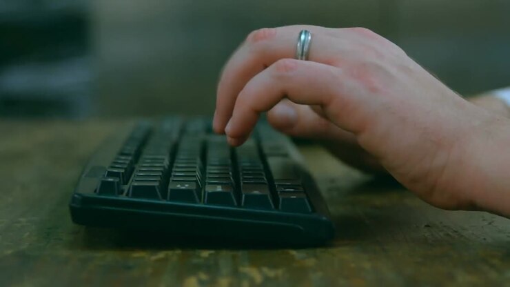 Animation of technology icons over hands of caucasian woman typing on keyboard