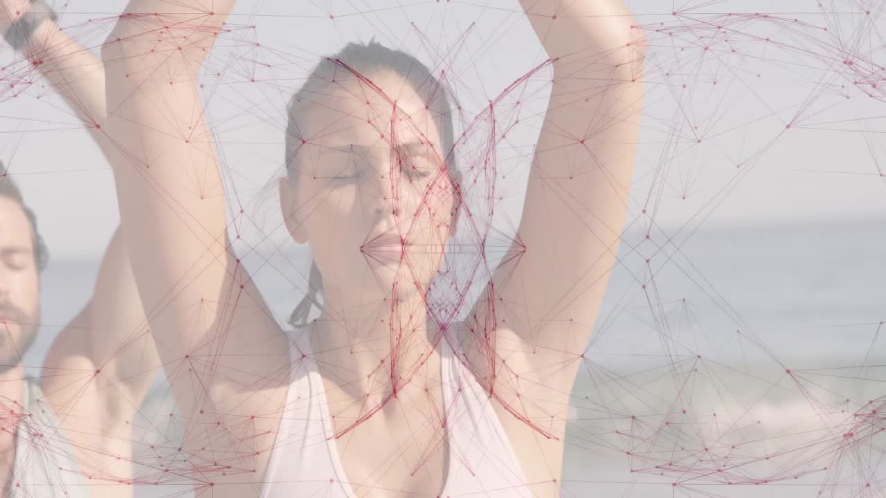 Ihmisiä meditoimassa rannalla punaisen geometrisen kuvioanimaation kanssa.
