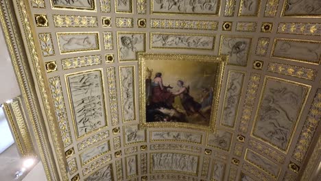 detailed view of louvre museum's ceiling and artifacts