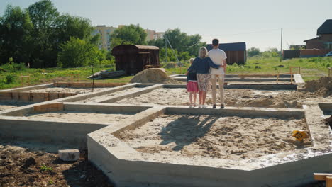 the family is on the foundation of their future home new beginnings concept