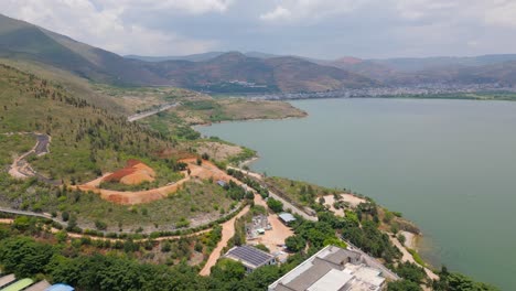 Panning-drone-footage-of-the-Luo-Quan-Peninsula-Tourism-Zone-and-the-majestic-view-of-Er-Hai