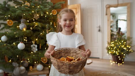 portrait of cute girl with natural christmas decorations