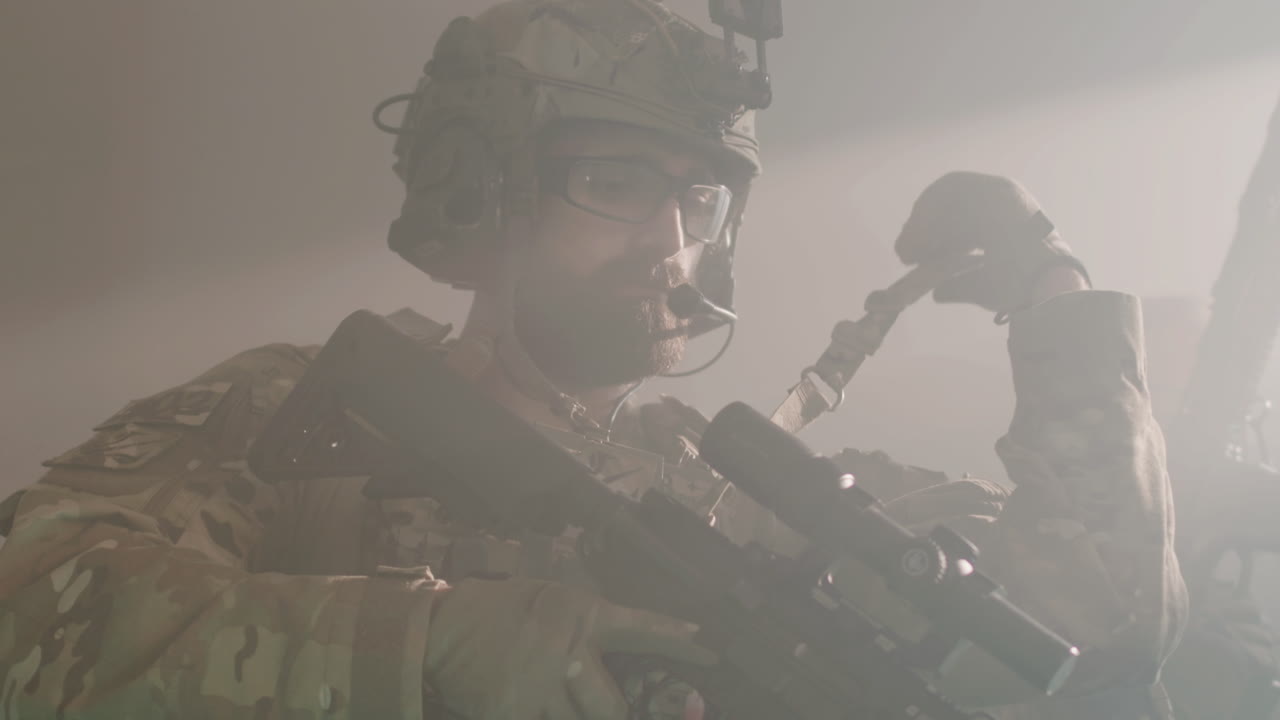 Man in camouflage uniform ready for airsoft military game