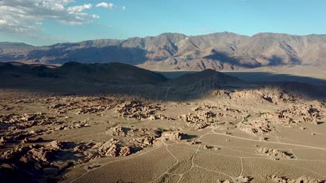 Drone-Aerial-View-on-Amazing-Landscape-of-Alabama-Hills-and-Desert-Under-Clouds-Shadows-on-Sunny-Summer-Day