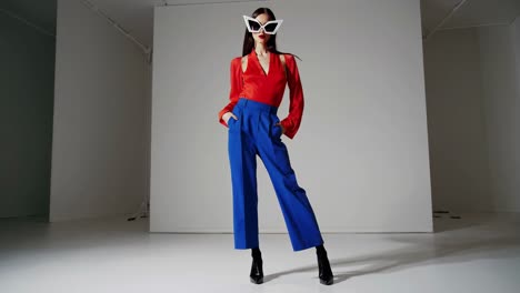 fashionable woman in red and blue outfit