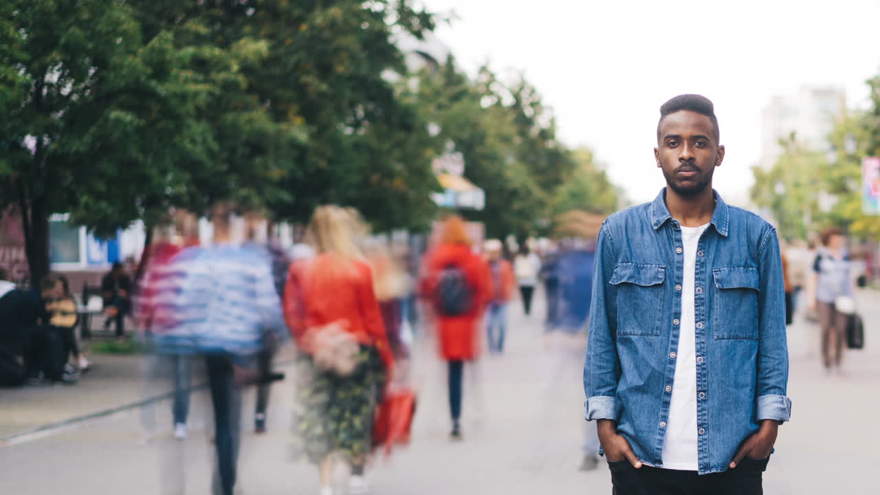 Man standing on a city street.