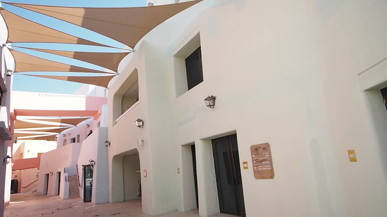 Pastel-colored alleyway with modern architecture