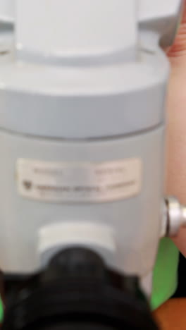 classmates looking through a microscope