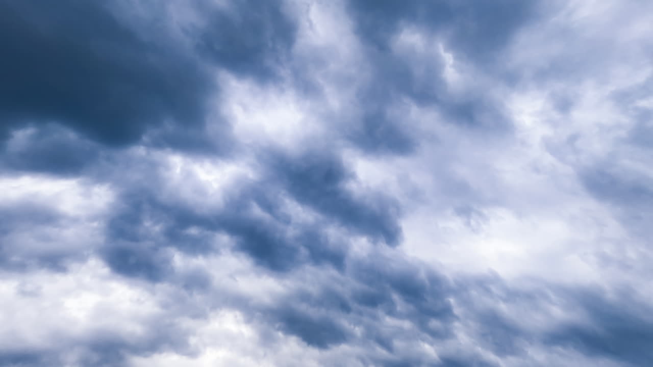 Dull grey cloudscape covering the sky. Overcast horizon from low angle perspective. Timelapse.