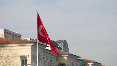 turkish flag flying above buildings