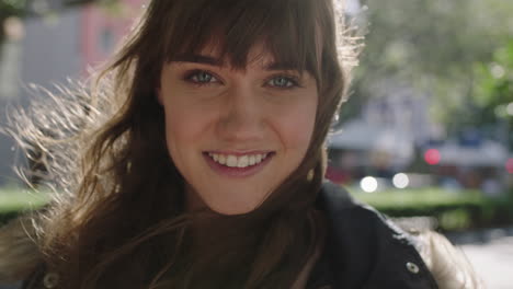 close-up-portrait-of-beautiful-cute-young-woman-smiling-cheerful-looking-optimistic-on-sunny-urban-sidewalk