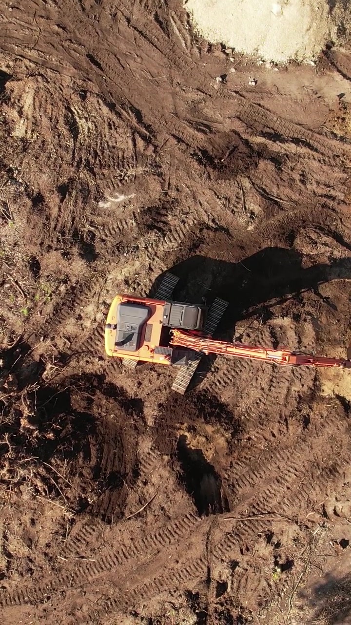 Top View excavator operating on a hillside