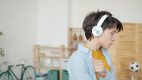 teenager dancing with headphones