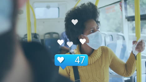 woman wearing mask on bus with social media likes animation over her
