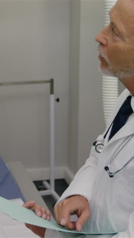 surgeon and colleague interacting with each other in medical room