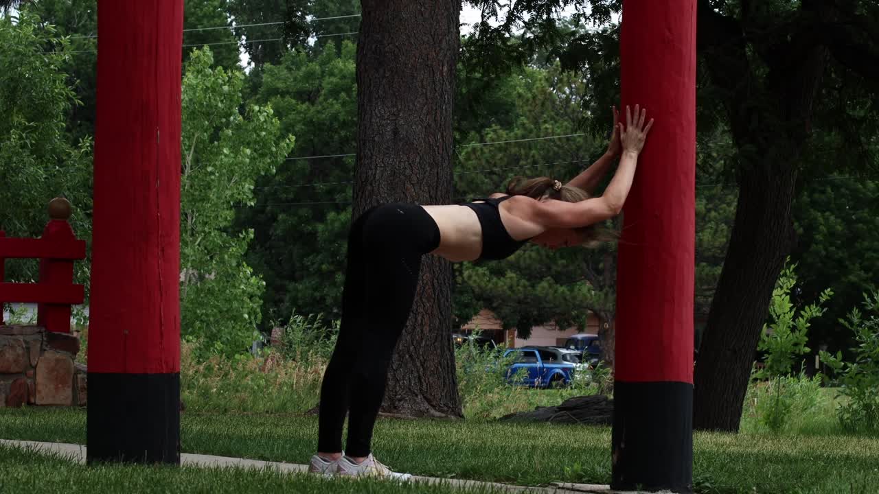 A runner stretches and limbers before going on a hot summer run