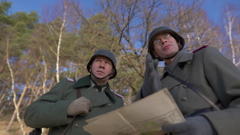 world war ii german soldiers studying a map