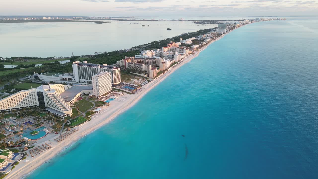 Cancun's coastline with crystal-clear water and luxury resorts, aerial view, playa delfines