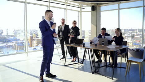 group business meeting in stylish office. handsome businessman thinking about new project.