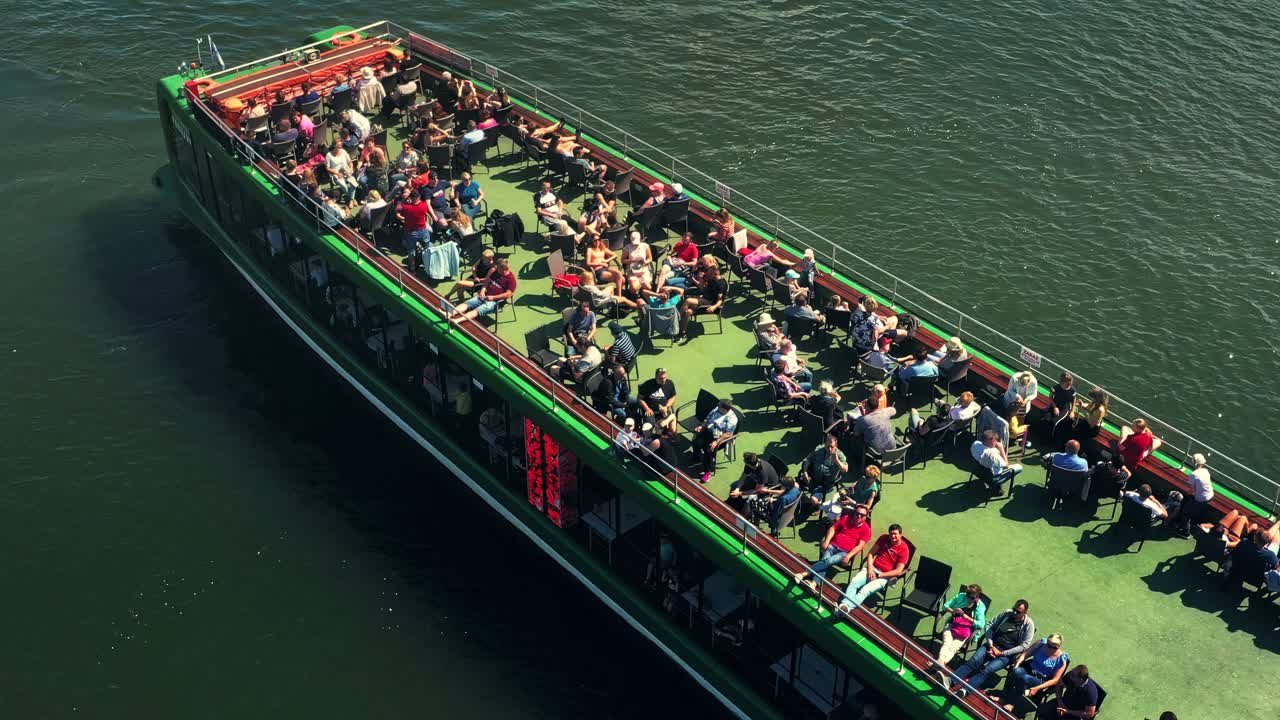 Aerial view of a cruising barge with tourists.