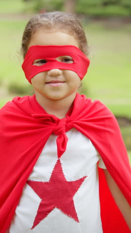 masked girl pretending to be superhero