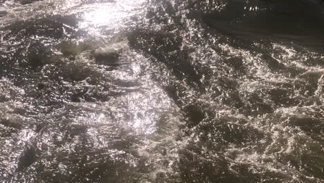 close up view of powerful water flowing in a natural river, long video